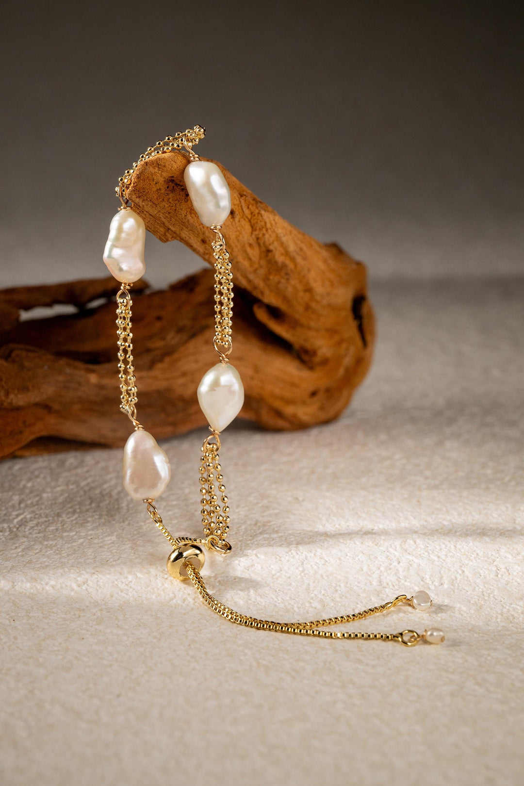 Dainty gold pearl bracelet: dashed freshwater Keshi pearls, adjustable gold-filled tassel