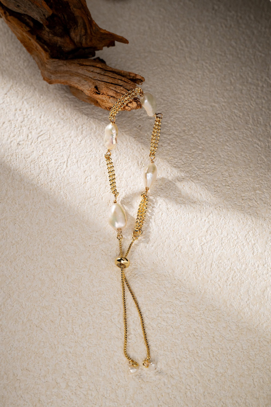 Dainty gold pearl bracelet: dashed freshwater Keshi pearls, adjustable gold-filled tassel