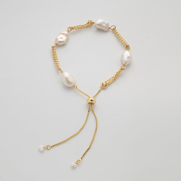 Dainty gold pearl bracelet: dashed freshwater Keshi pearls, adjustable gold-filled tassel
