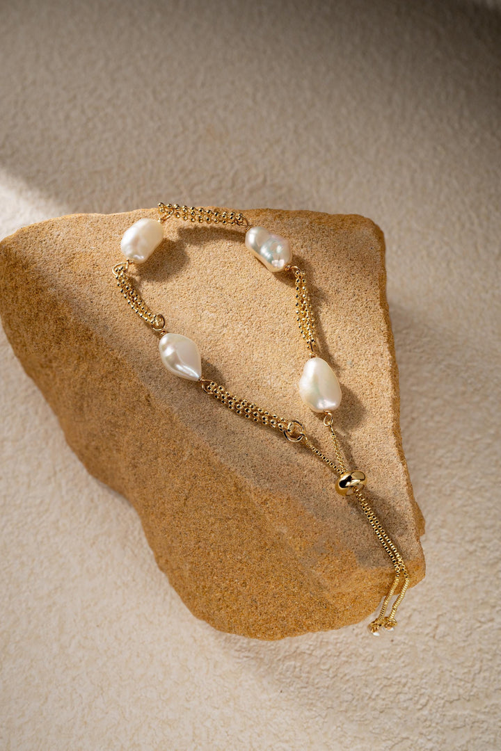 Dainty gold pearl bracelet: dashed freshwater Keshi pearls, adjustable gold-filled tassel