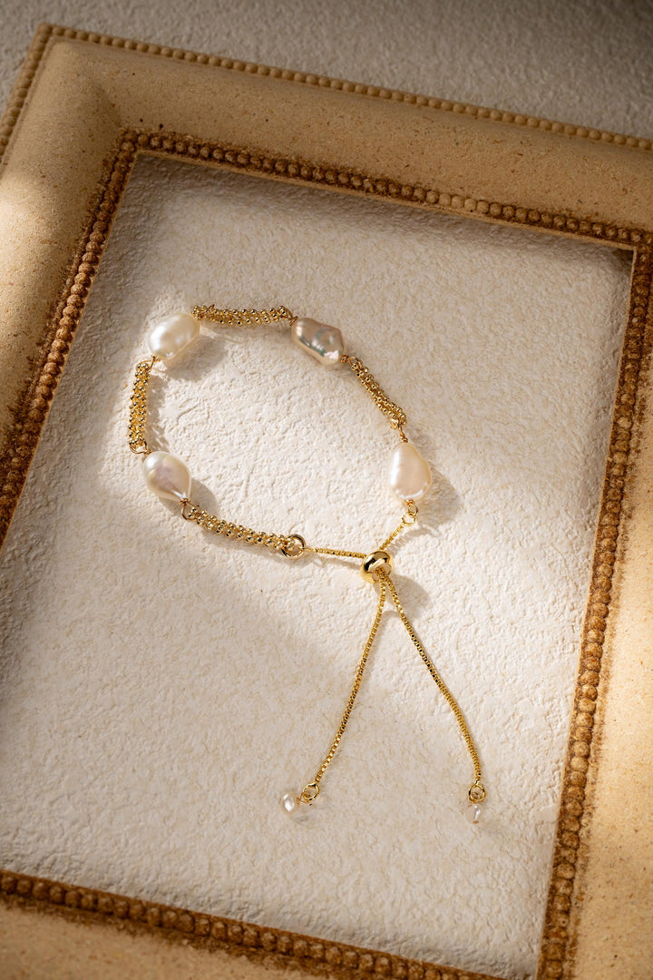 Dainty gold pearl bracelet: dashed freshwater Keshi pearls, adjustable gold-filled tassel