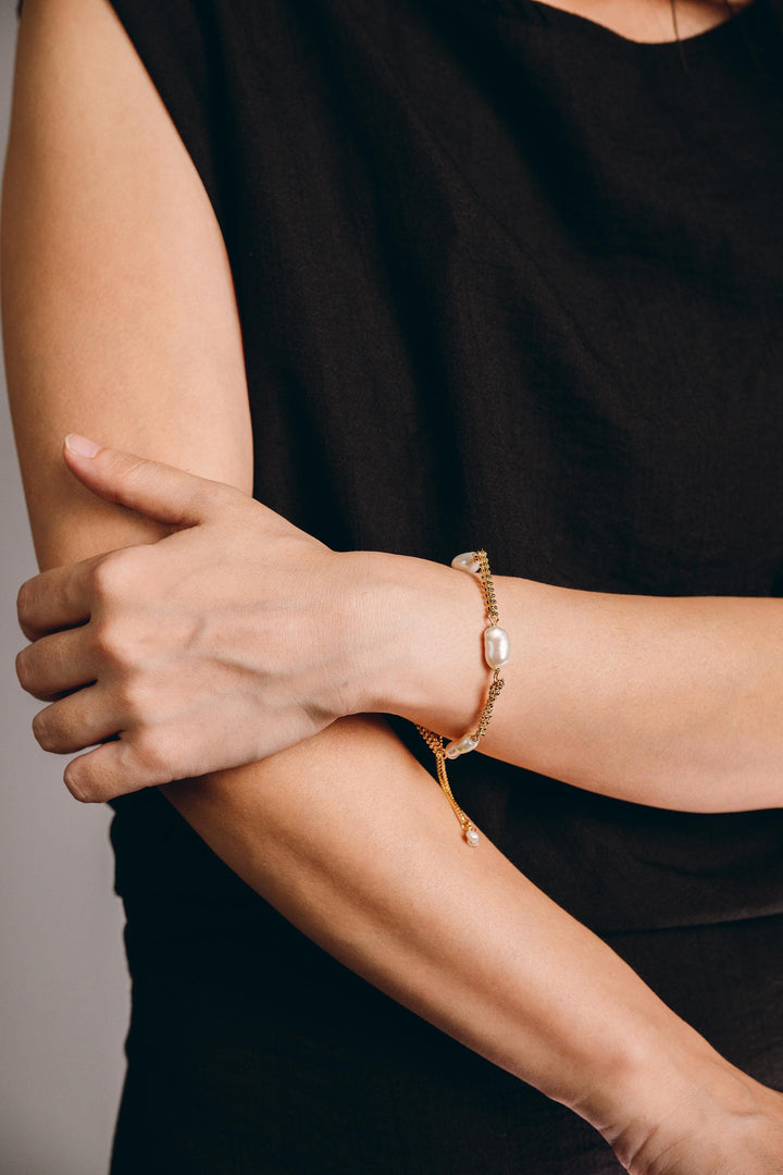 Dainty gold pearl bracelet: dashed freshwater Keshi pearls, adjustable gold-filled tassel
