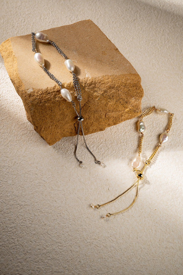 Dainty gold pearl bracelet: dashed freshwater Keshi pearls, adjustable gold-filled tassel